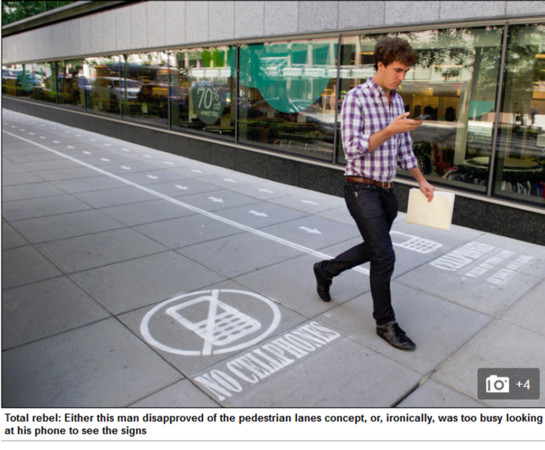 低头族滑手机挡路? 美国华府划「禁用手机人行