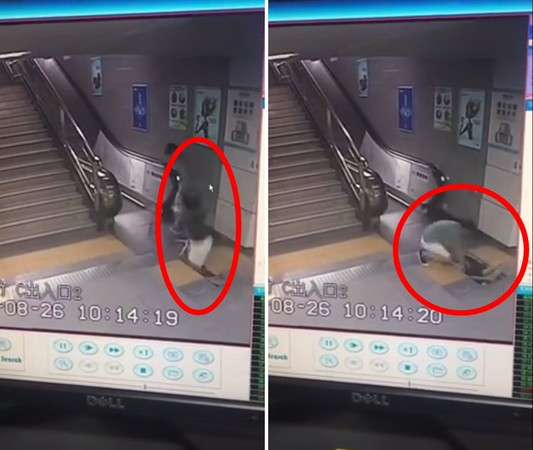 ▼深圳一名女乘客在地铁站搭电扶梯时被「吃掉」(图/翻摄自秒拍)