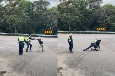 傻眼影片曝光！國道警賣力壓制失控男…學長在一旁講電話「完全不幫」